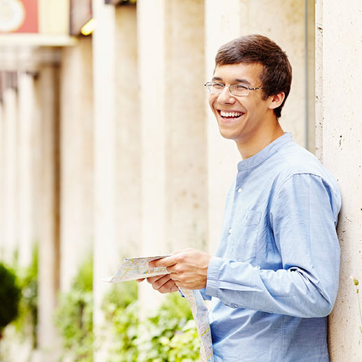 Man with glasses laughing